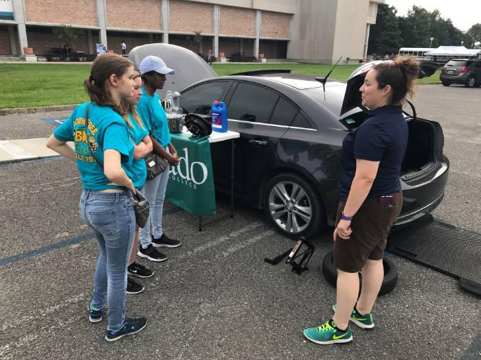 Samantha Candler, instructor of Motor Vehicle Technology, meets with Girl Scouts.