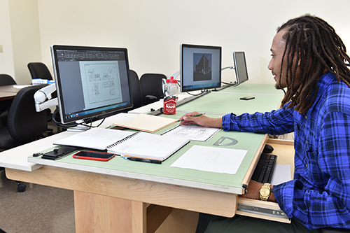 Architectural student working on a CAD program