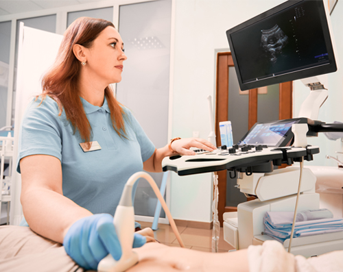 female taking a sonogram