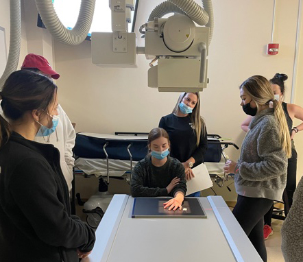 students at an x-ray machine