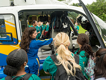 students viewing hospital helicopter