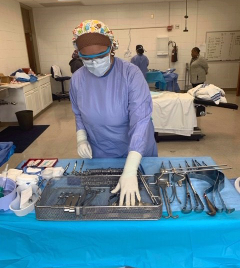 student looking at surgery tools