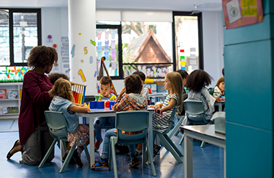 group of students at a table with teacher