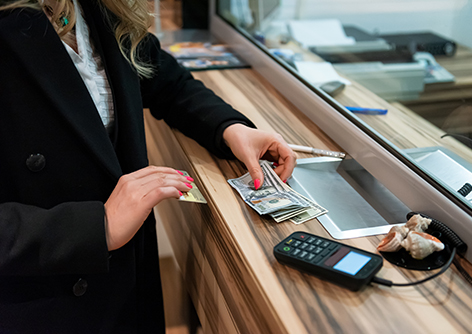 money exchaning at a bank window