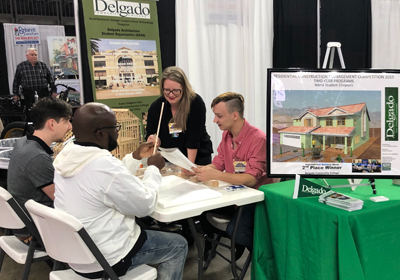 architectural students at a booth during a conference