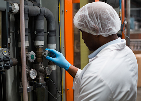 african american male working in a plant