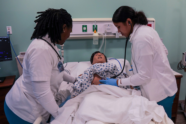 PN students working on a patient simulator