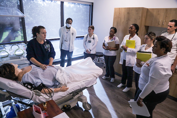 group of RN students with instuctor