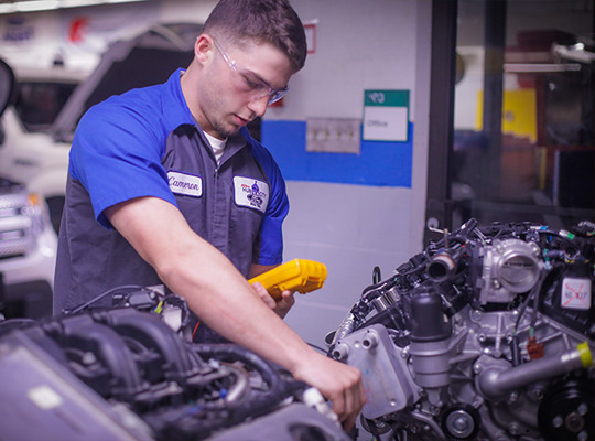 student running test on an engine