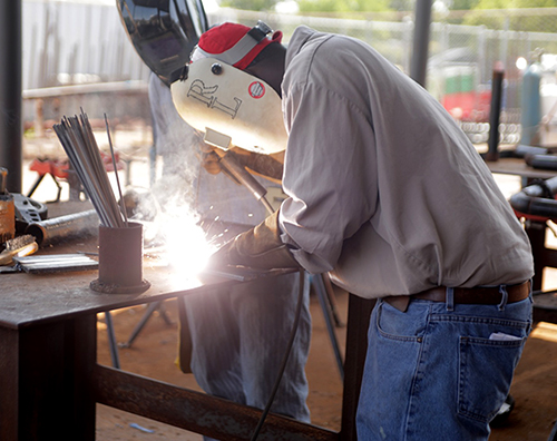 student practicing with welding mask on 