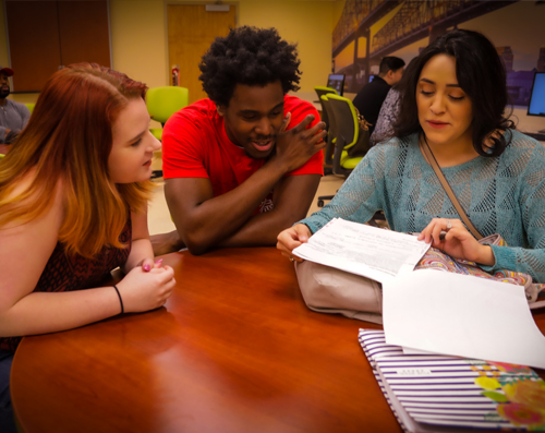 A group of students reviewing homework