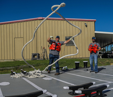 deckhand throwing a rope