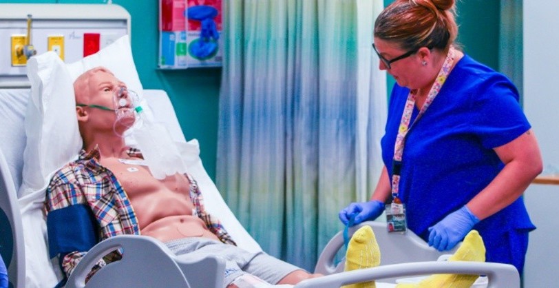 nursing student in a simulated patient care facility