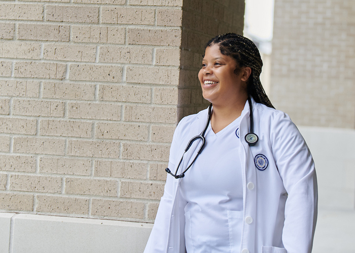 female nursing student by Ochsner building