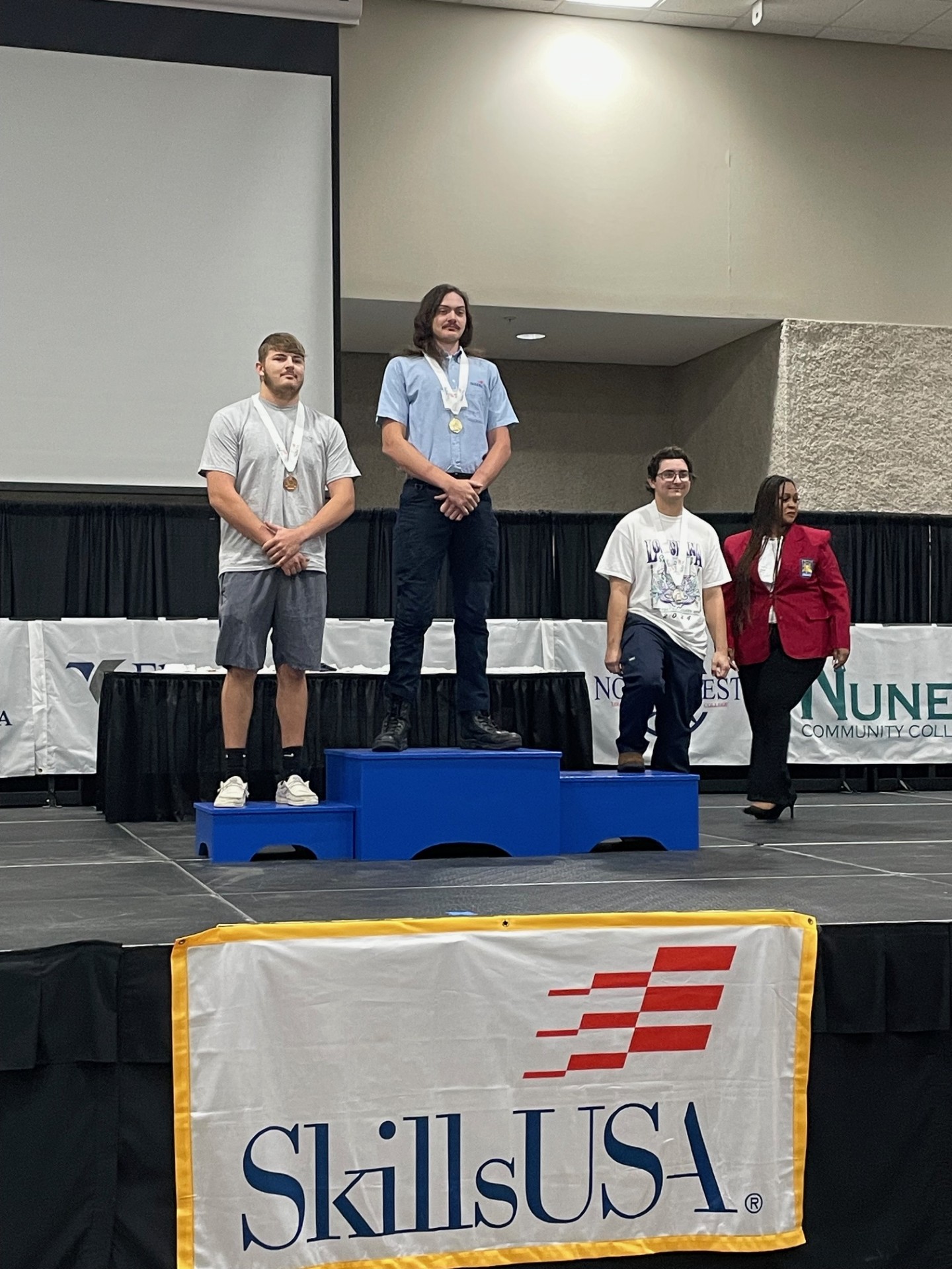 Thibodeaux receiving his gold medal