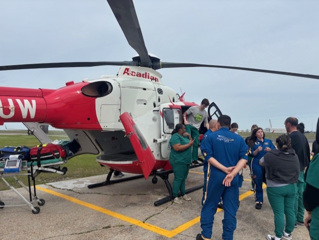 Students and Ochsner staff outside the helicopter