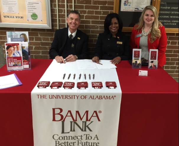 At an Oct. 25 ceremony to formalize the new partnership between Delgado Community College and the University of Alabama, from left: Dr. Peter Fos, Delgado interim vice chancellor for academic affairs; Joan Davis, Delgado chancellor; Brandi Stacey, community college relations coordinator, University of Alabama College of Continuing Studies.