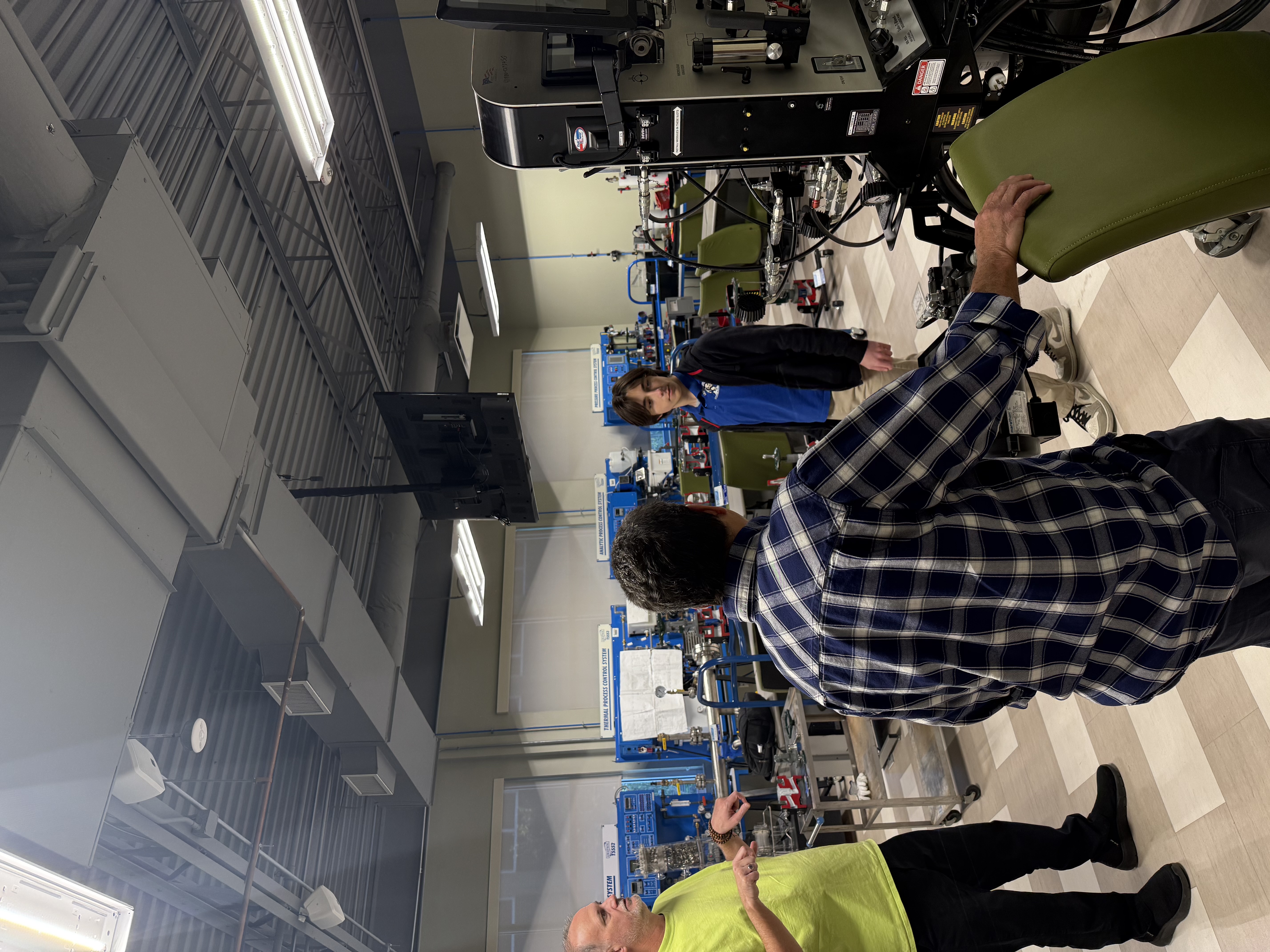 Dual enrollment students investigate equipment they will learn to use in their program