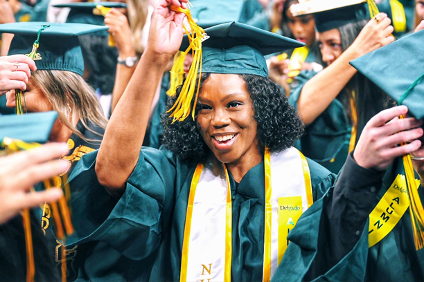 student turning her tassle at graduation