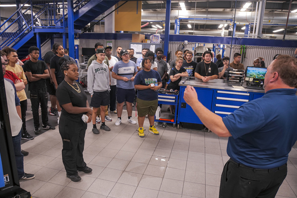 students touring an open house at Mercedes Benz dealership