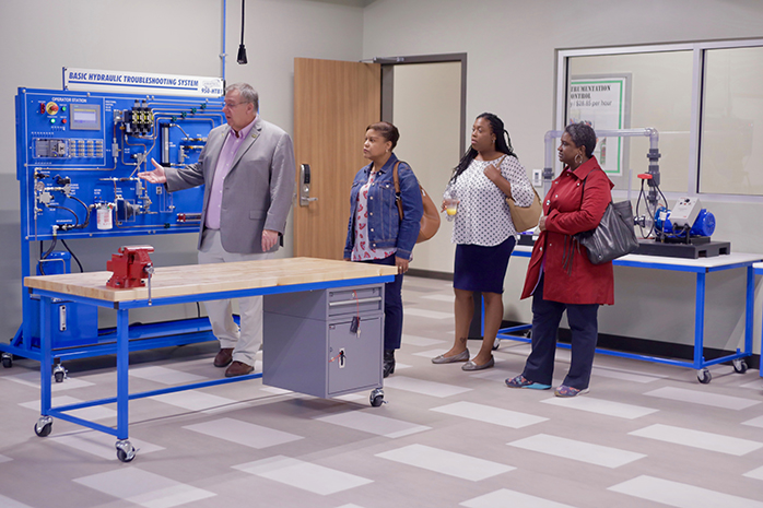 Ed VanAvery leads a tour of the new River City facility