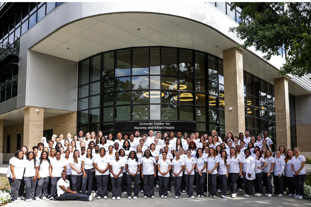 Spring 2025 RN Graduates in front of Delgado's Ochsner Center for Nursing and Allied Health