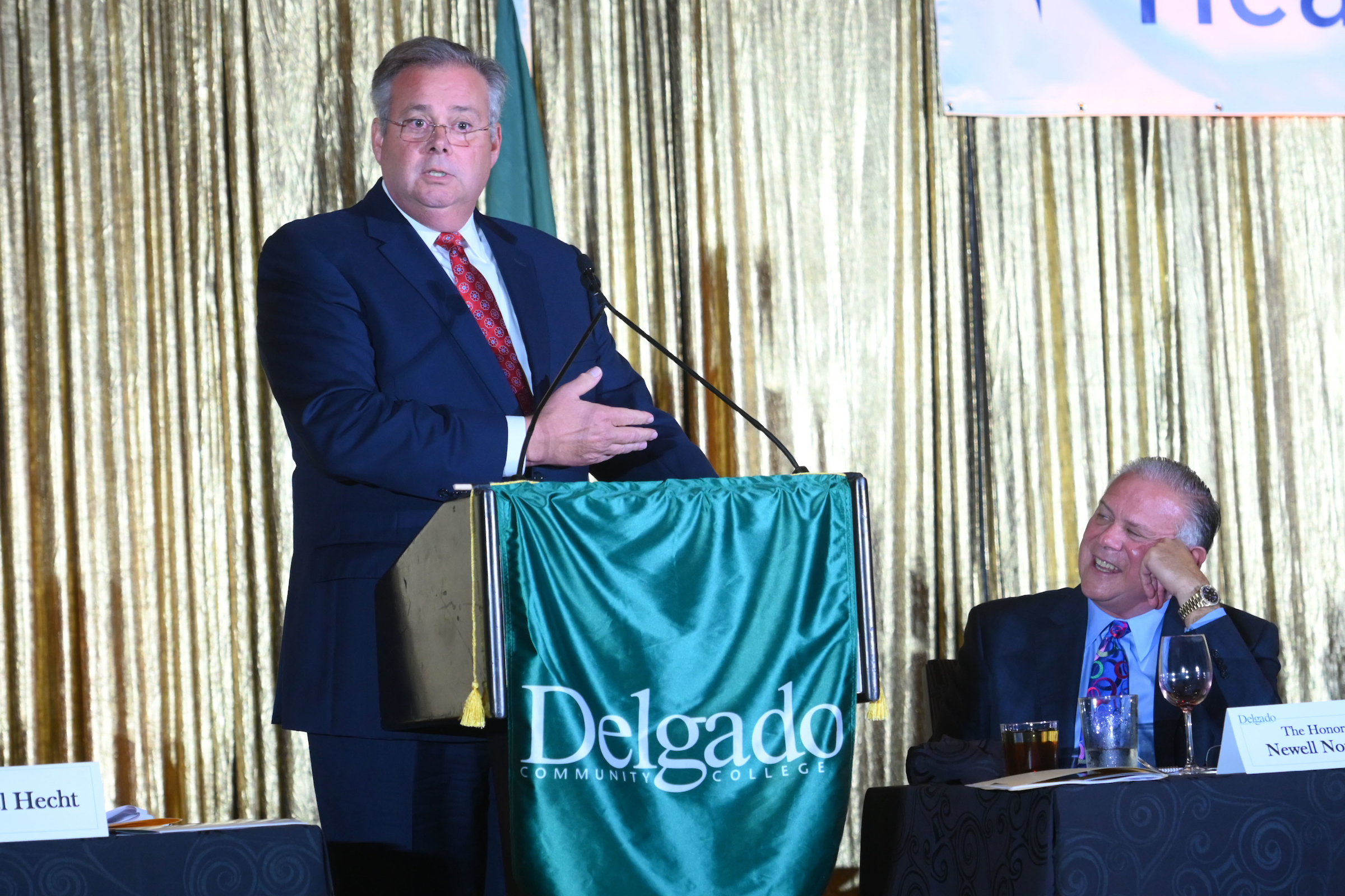 Ronald Serpas at the podium with Newell Normand