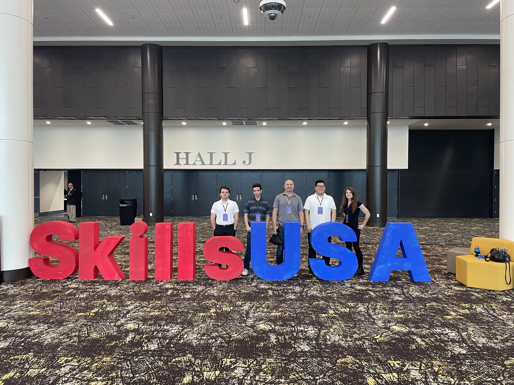 Students pose at the Skills USA sign
