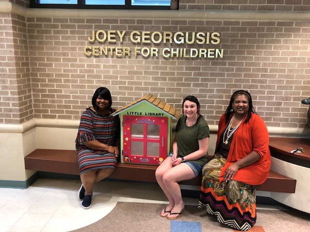 Pictured, from left: Dr. Dionne Nichols, director of the Joey Georgusis Center for Children; Ariel Alonso; Patrice Moore, dean of the Division of Arts and Humanities.