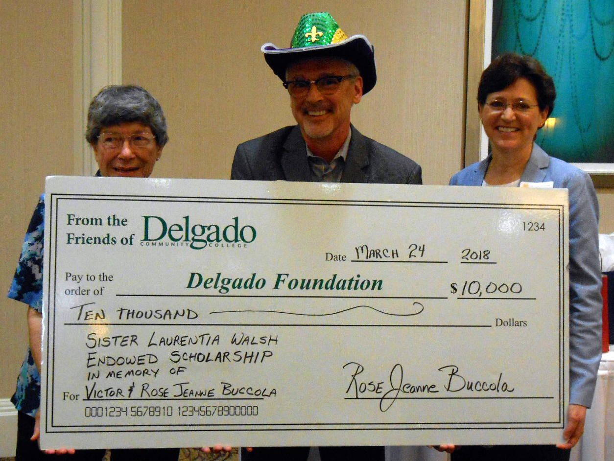 Mrs. Buccola is a 1949 graduate of Charity Hospital School of Nursing, and is pictured with Charity Alumni Association President Bryan Camus, center, and Dr. Cheryl Myers, executive dean of Delgado Charity School of Nursing, right.