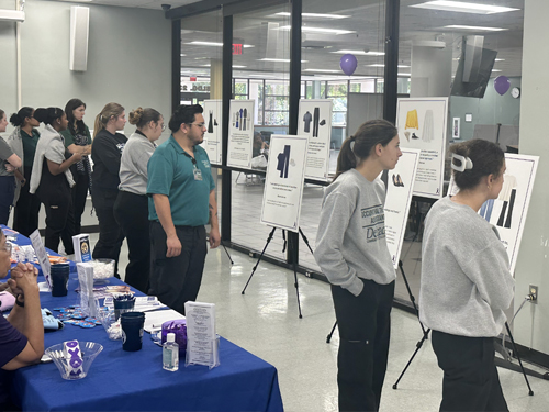 group of students looking at the exhibit