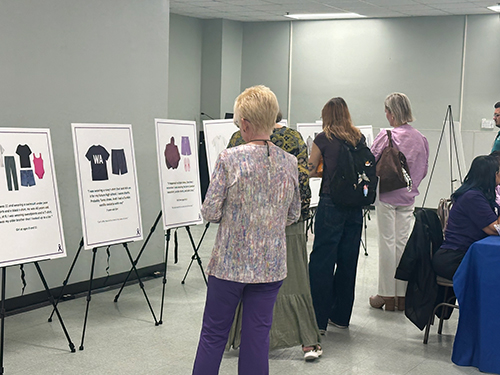 faculty and community members at the exhibit