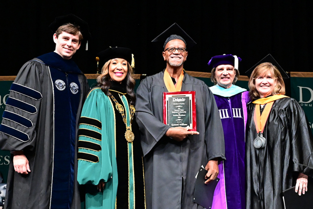 Mr. Williams receiving his award at graduation