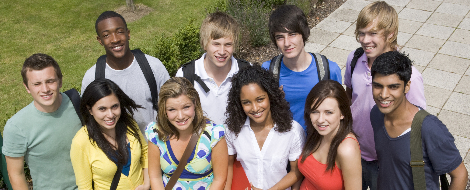 A group of freshman Delgado students smile as their picture is taken during Freshman Convocation