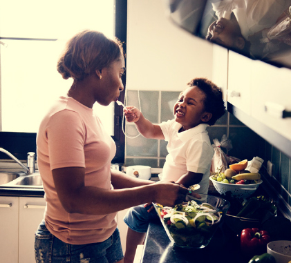 single mom with small child in the kitchen