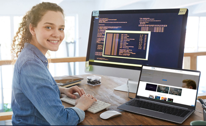 female in front of a computer creating a website